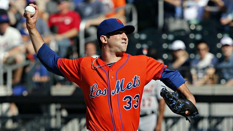 Mets starting pitcher Matt Harvey delivers in the top of...