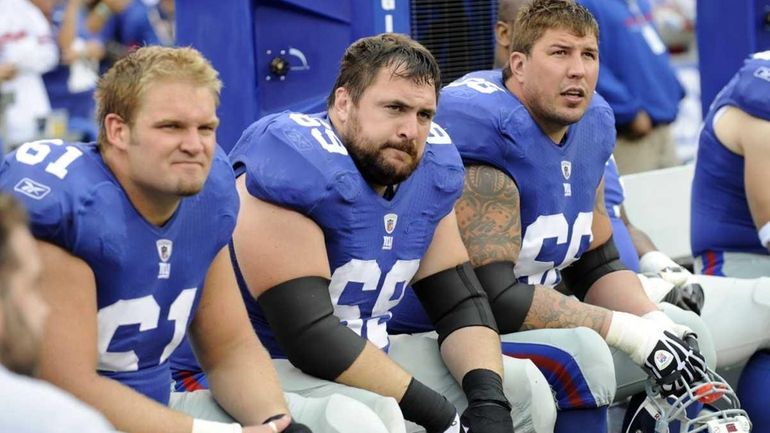 Rich Seubert, second from left, and David Diehl, right, are...