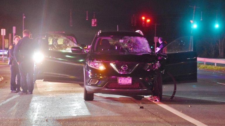 Suffolk County police at the scene where an SUV struck...