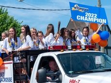 Manhasset boys and girls lacrosse teams celebrated in championship parade