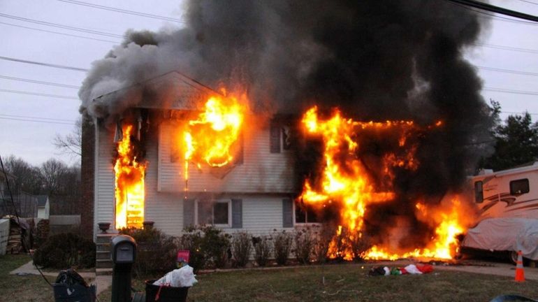 An early morning fire ravaged a two-story home in Ronkonkoma,...