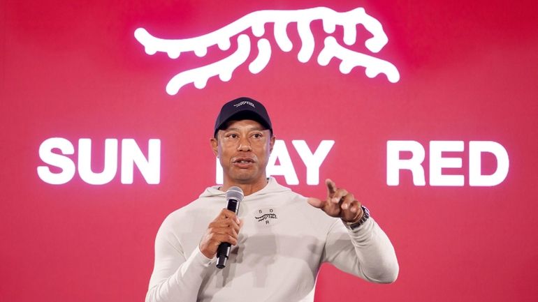 Tiger Woods speaks at a news conference ahead of the...