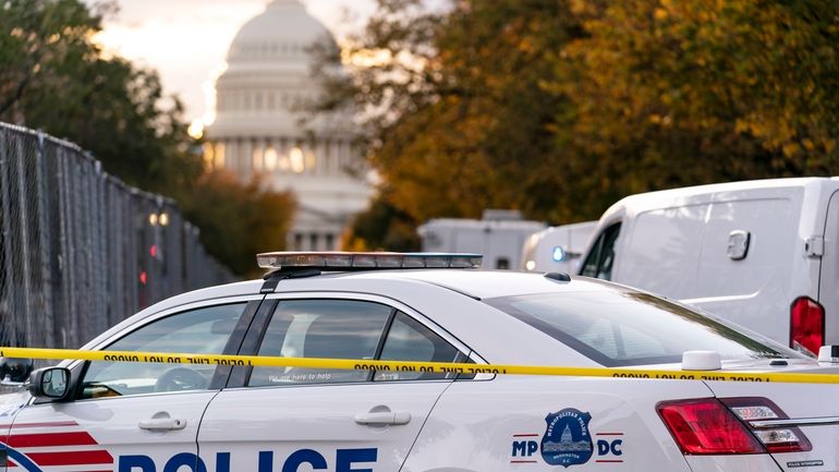 A Washington Metropolitan Police vehicle is seen near the Capitol,...