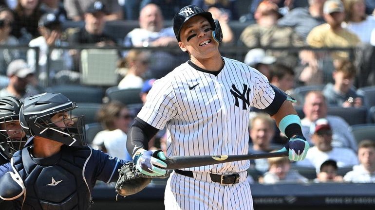 Yankees’ Aaron Judge reacts after striking out swinging against the...