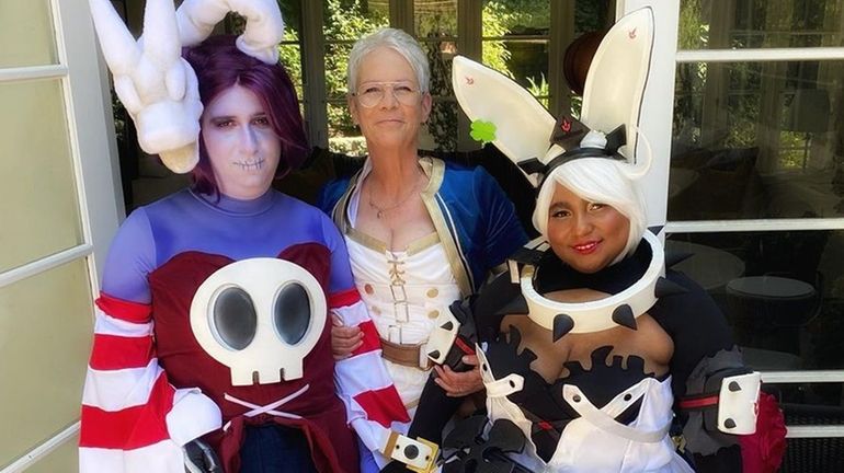 Jamie Lee Curtis stands with daughter Ruby, left, and daughter-in-law Kynthia...