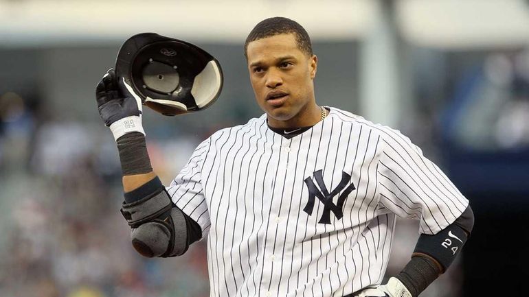 Robinson Cano of the Yankees looks on after grounding out...