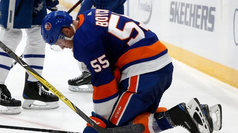 Johnny Boychuk of the Islanders is injured late during the...