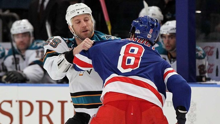 Brandon Prust of the New York Rangers fights Ryane Clowe...