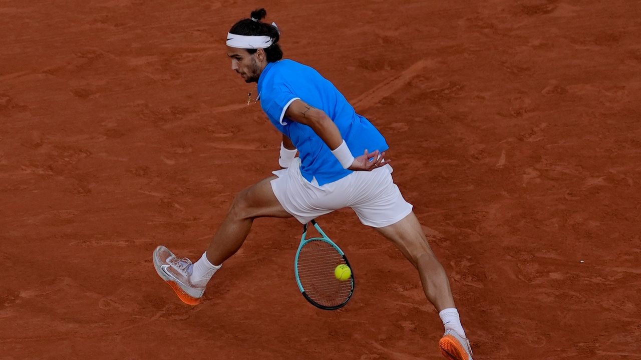 Olympic tennis Lorenzo Musetti of Italy beats Felix AugerAliassime