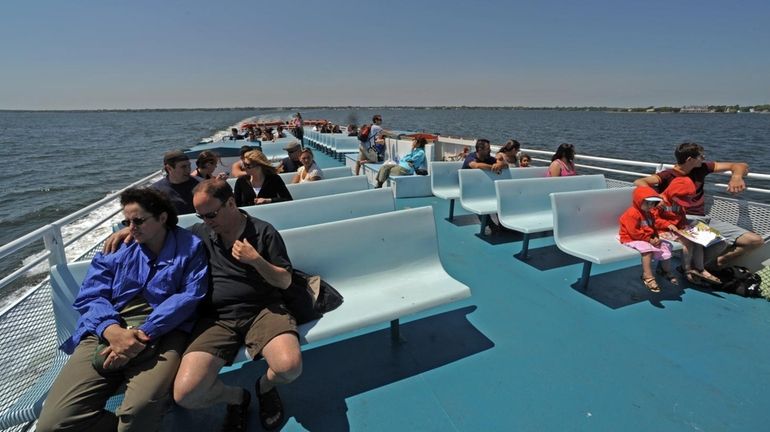 Residents and visitors aboard the ferry to Fire Island. (May...