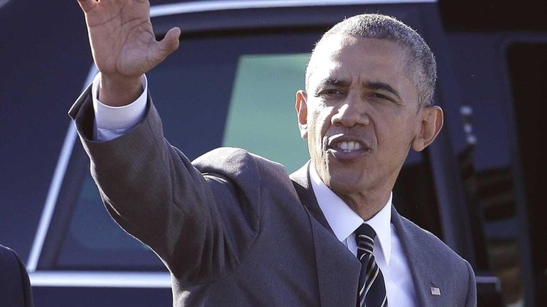 President Barack Obama waves after arriving in Portland, Ore., Thursday,...