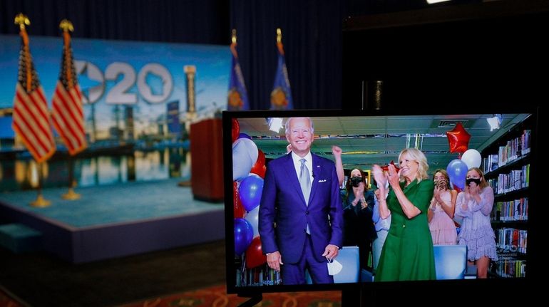 Joe Biden with his wife, Jill Biden, in a live...