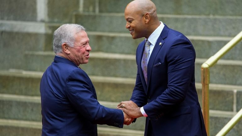 Maryland Gov. Wes Moore greets King Abdullah II of Jordan...