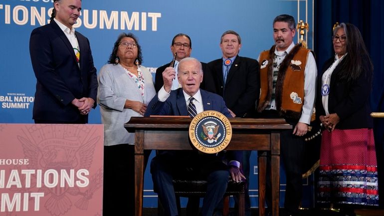 President Joe Biden speaks before signing an executive order at...