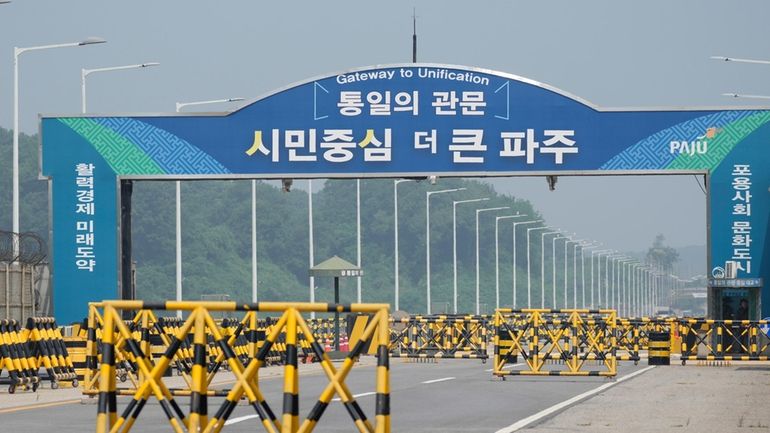 Barricades are placed near the Unification Bridge, which leads to...