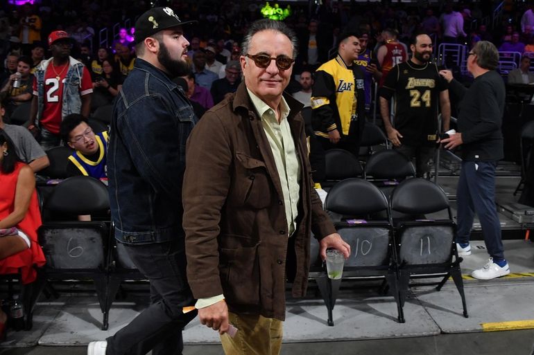 Kendall Jenner, center, sits courtside with Bad Bunny during the second  half in Game 6 of an NBA basketball Western Conference semifinal series  between the Los Angeles Lakers and the Golden State