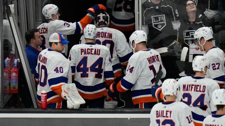 Islanders players leave the ice after the team's 5-2 loss...