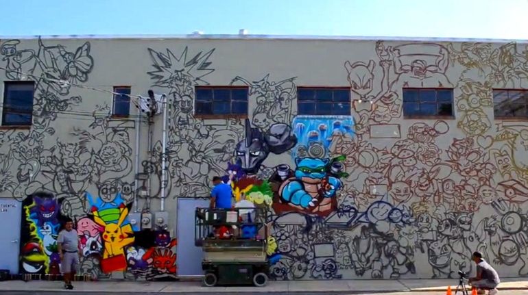 A 25-foot mural painted by artist Efren Andaluz in Huntington...