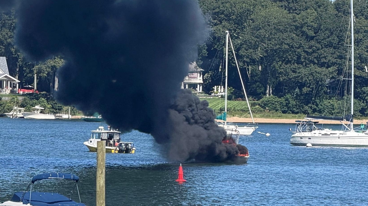 Huntington boat fire: Tow captain pulls blazing vessel away from fuel, other boats