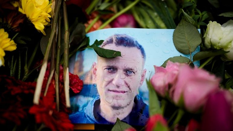 Rain drops cover a portrait of Russian opposition leader Alexei...