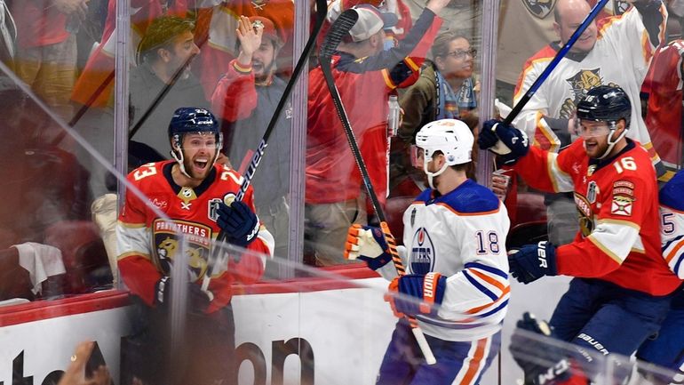 Florida Panthers center Carter Verhaeghe (23) celebrates with center Aleksander...