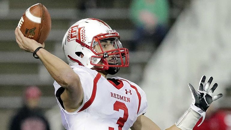 East Islip quarterback Kyle Fleitman (3) makes a pass during...