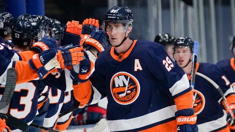 Islanders' Brock Nelson (29) celebrates with teammates after scoring a...