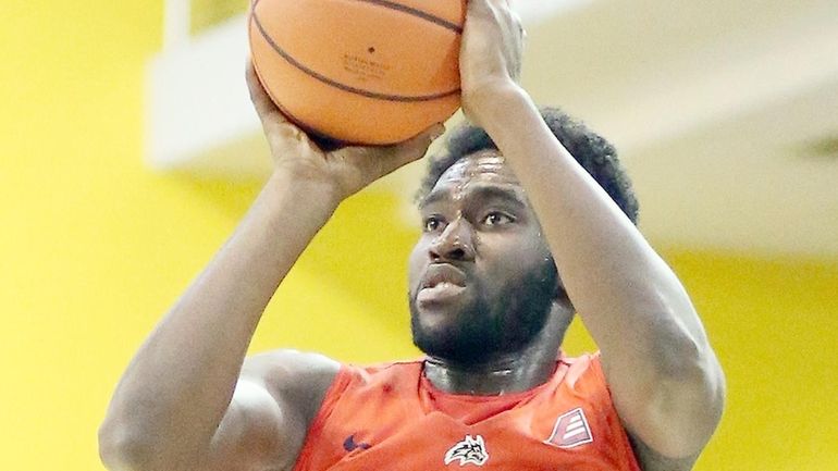 Stony Brook's Akwasi Yeboah shoots from outside against LIU Brooklyn...