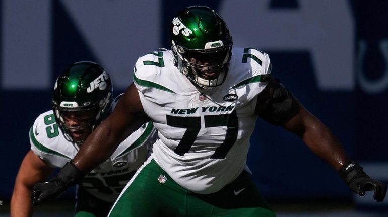 Jets tackle Mekhi Becton steps out to block Colts defensive end...