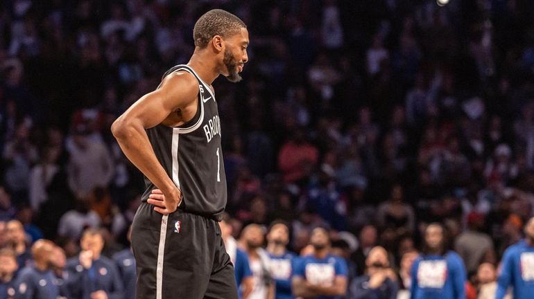 Nets’ Mikal Bridges looks on against the Philadelphia 76ers with time...