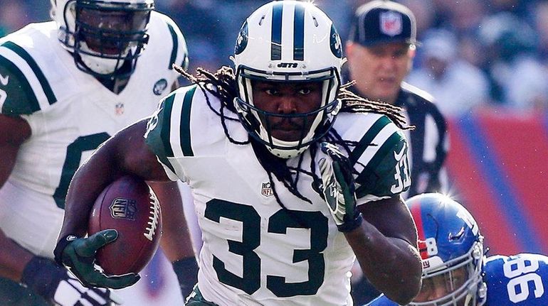 Chris Ivory #33 of the New York Jets runs the...