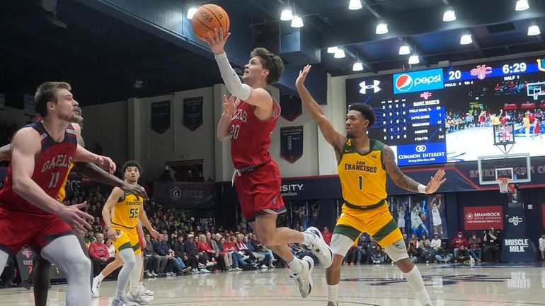 Saint Mary's guard Aidan Mahaney (20) shoots in front of...