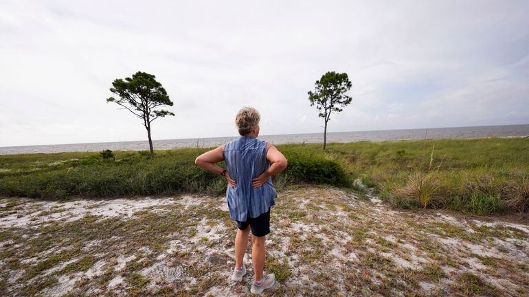 Paulette McLin takes in the scene outside their summer home...