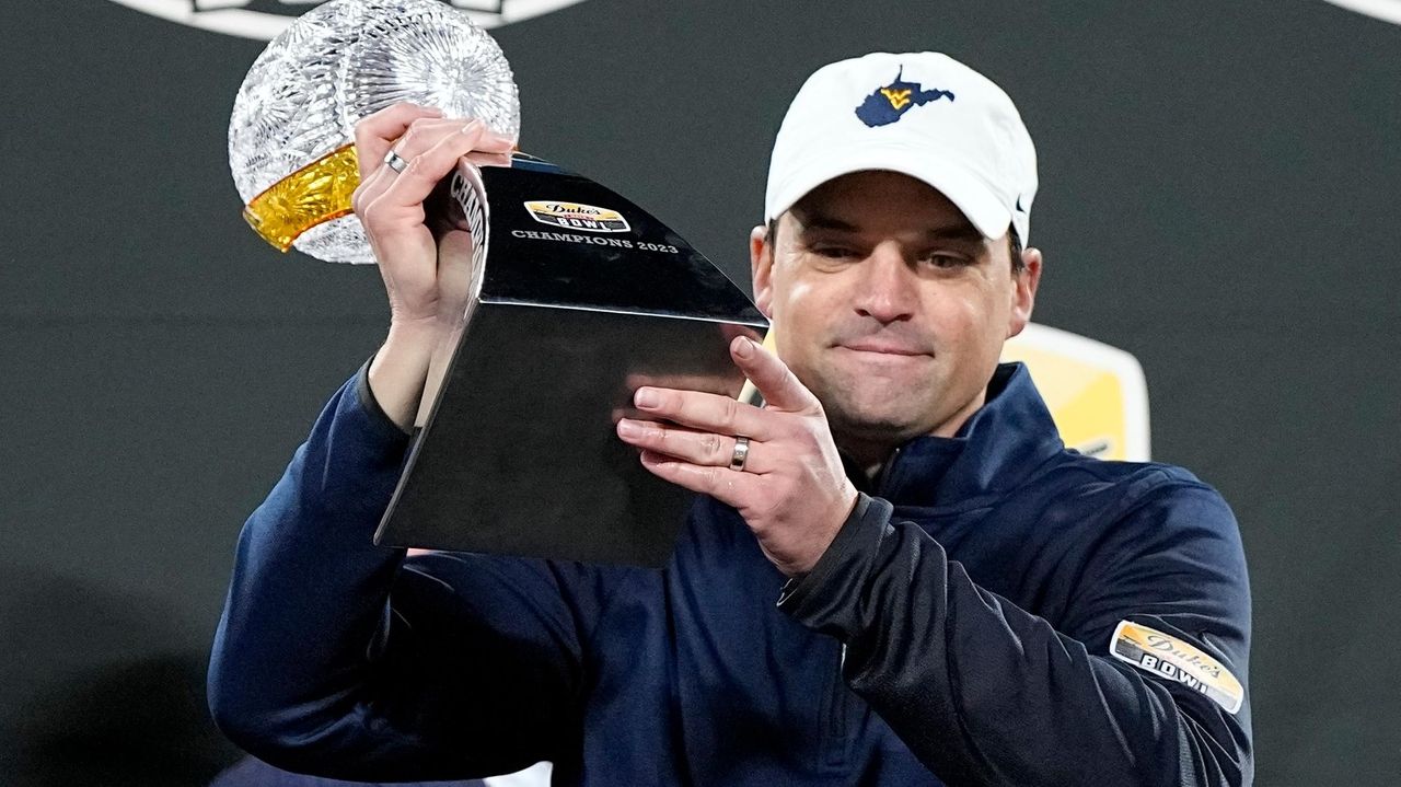 West Virginia coach Neal Brown agrees to modest pay cut in 1-year ...