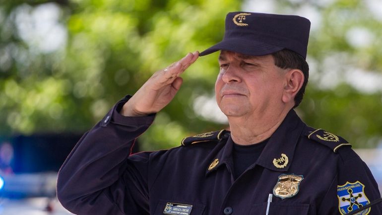 El Salvador's National Police Director Mauricio Arriaza salutes during the...