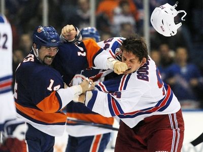 New York Islanders' Trevor Gillies (14) and New York Rangers'...