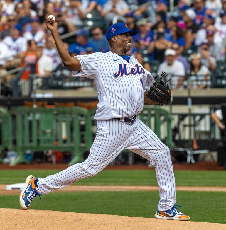 Former New York Mets pitcher Dwight Gooden throws during an Old-Timers'  game before a baseball game between the Colorado Rockies and the New York  Mets on Saturday, Aug. 27, 2022, in New