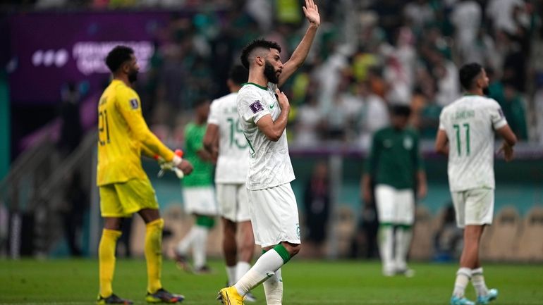 Saudi Arabia's Abdulrahman Al-Aboud reacts at the end of the...