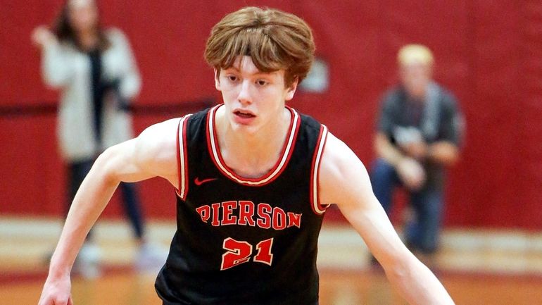 Pierson's Luke Seltzer carries the ball in the second quarter...