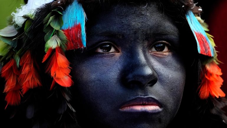 An Indigenous girl prepares to take part in a ritual...