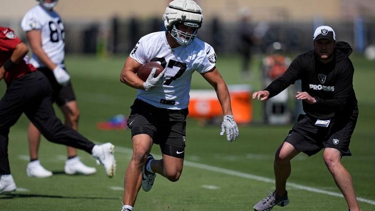 Las Vegas Raiders tight end Michael Mayer (87) runs during...