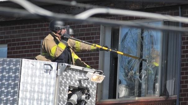 Police break the window of the apartment of of James...