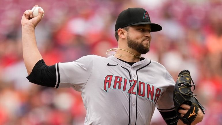 Arizona Diamondbacks starting pitcher Slade Cecconi throws in the first...