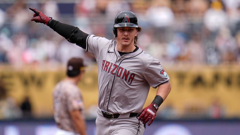 Arizona Diamondbacks' Jake McCarthy celebrates after hitting a two-run home...