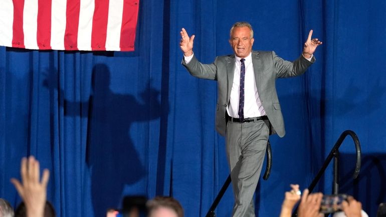 Former Independent candidate for president Robert F. Kennedy, Jr. waves...