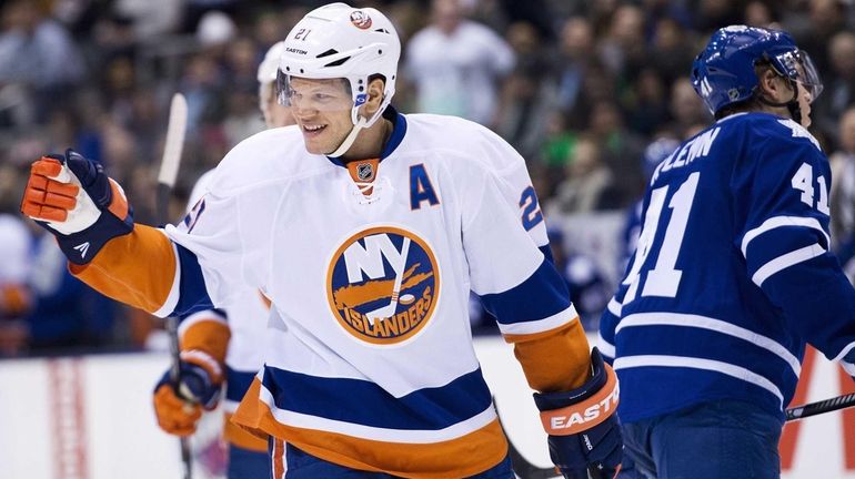 Islanders forward Kyle Okposo reacts after scoring a goal against...