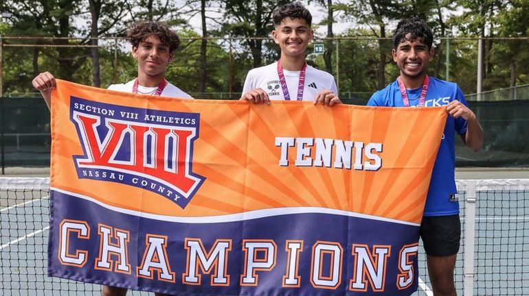 From left, doubles winners Devan Melandro and Nikhil Shah of...