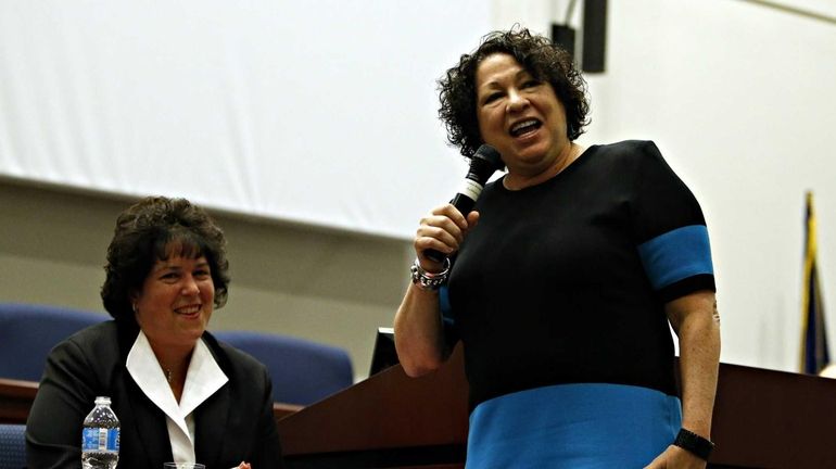 Supreme Court Justice Sonia Sotomayor (front) quips with dean Patricia...