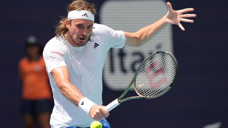 Stefanos Tsitsipas of Greece returns to Cristian Garin of Chile...