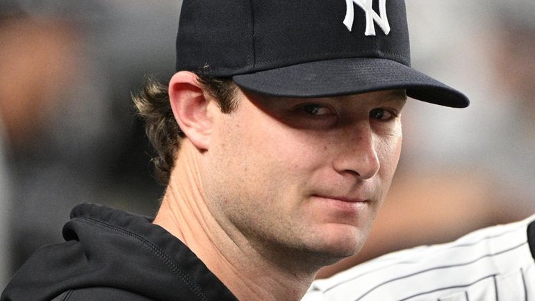 Yankees pitcher Gerrit Cole in the dugout against the Houston...